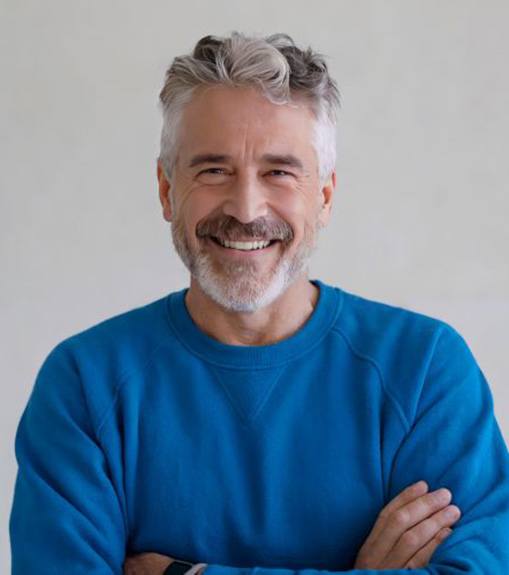 Confident senior man wearing blue sweatshirt