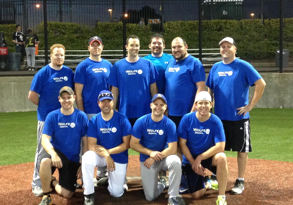 Baseball team all wearing matching Wolfe Dental shirts