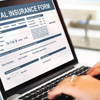 patient filling out dental insurance form on app