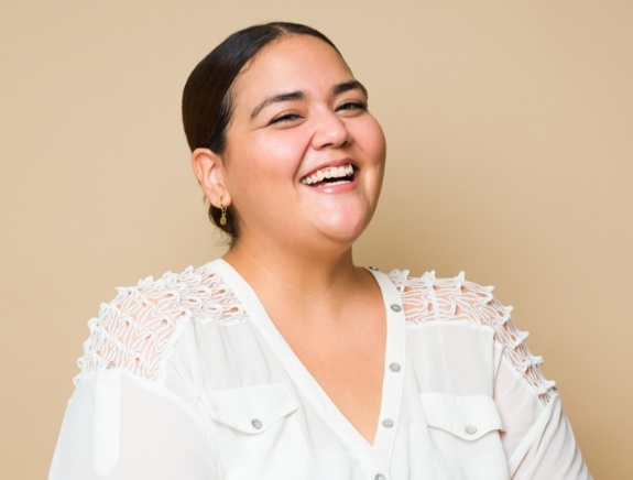 Smiling woman in white blouse