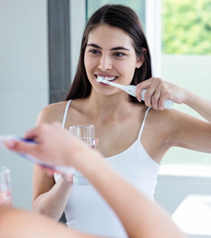 Woman brushing her teeth