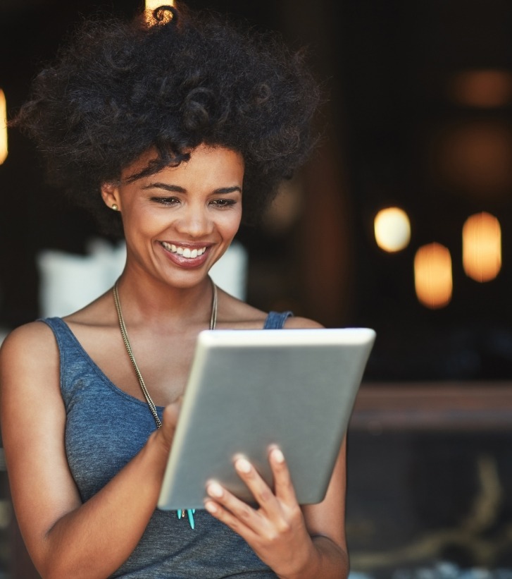 Smiling woman using a tablet