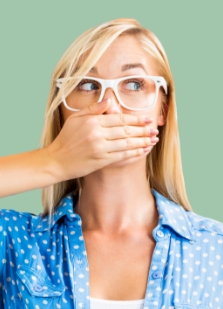 Woman covering her mouth with one hand