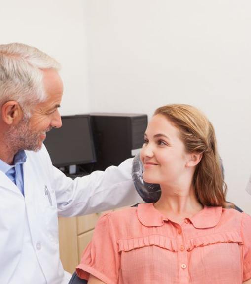 Dentist and patient engaged in a friendly conversation